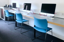 Meeting room with a row of computers